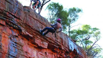 People rock climbing
